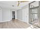 Bright bedroom featuring a ceiling fan and a large door to a patio, a walk-in closet at 250 Park Avenue West Nw # 313, Atlanta, GA 30313