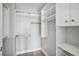 Walk-in closet with custom white shelving and ample storage space for an organized wardrobe at 250 Park Avenue West Nw # 313, Atlanta, GA 30313