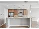 Modern kitchen featuring sleek countertops, stainless steel appliances, mosaic backsplash, and bar seating area at 250 Park Avenue West Nw # 313, Atlanta, GA 30313