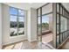 Bright room featuring large windows, tile flooring, and a balcony view, perfect for relaxing and enjoying the city scenery at 250 Park Avenue West Nw # 313, Atlanta, GA 30313