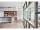 Open-concept kitchen with a breakfast bar, stainless appliances, and access to a balcony with city views, great for entertaining at 250 Park Avenue West Nw # 313, Atlanta, GA 30313
