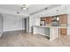 Spacious, open living area with hardwood floors, modern kitchen featuring a breakfast bar, and plenty of natural light at 250 Park Avenue West Nw # 313, Atlanta, GA 30313