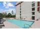 Outdoor swimming pool with lounge chairs and a clear view of the city skyline at 250 Park Avenue West Nw # 313, Atlanta, GA 30313
