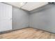 Clean basement space featuring wood-look flooring and painted walls at 2695 Peeler Rd, Dunwoody, GA 30360