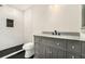 Bathroom featuring stand-up shower with a dark tiled floor and granite vanity at 2695 Peeler Rd, Dunwoody, GA 30360