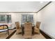 Elegant dining room with hardwood floors and natural light, ideal for gatherings at 2695 Peeler Rd, Dunwoody, GA 30360