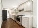 Modern kitchen with stainless steel appliances, sleek countertops, and ample cabinet space at 2695 Peeler Rd, Dunwoody, GA 30360
