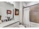 Tastefully designed bathroom featuring modern fixtures, white cabinetry, and a shower-over-tub configuration at 3980 Allegretto Cir, Atlanta, GA 30339