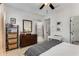 Serene bedroom with a dresser and decoratively arranged furnishings bathed in natural light from the window at 3980 Allegretto Cir, Atlanta, GA 30339