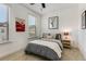 Well-lit bedroom with neutral decor, a comfortable bed, and unique wall art adding character to the space at 3980 Allegretto Cir, Atlanta, GA 30339