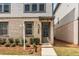 Charming home exterior with brick accents, tidy landscaping, and a welcoming entrance with visible house number at 3980 Allegretto Cir, Atlanta, GA 30339