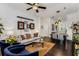 Bright living room with dark hardwood floors, comfortable seating, and an open layout connecting to the dining area at 3980 Allegretto Cir, Atlanta, GA 30339