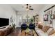 Cozy living room with dark hardwood floors, stylish furniture, and a decorative gallery wall at 3980 Allegretto Cir, Atlanta, GA 30339