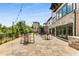 A large outdoor patio space with tables, chairs, and string lights, perfect for entertaining guests at 3980 Allegretto Cir, Atlanta, GA 30339