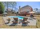 Inviting backyard showcasing a sparkling pool, lounge chairs and outdoor seating area at 880 Crossfire Nw Rdg, Marietta, GA 30064