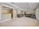 Large basement area with a wet bar, two sofas and a walkout entrance at 880 Crossfire Nw Rdg, Marietta, GA 30064