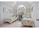 Bright bedroom with two beds, natural light, and vaulted ceiling at 880 Crossfire Nw Rdg, Marietta, GA 30064