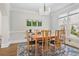 Dining room with hardwood floors, picture frame molding, large window and seating for six at 880 Crossfire Nw Rdg, Marietta, GA 30064