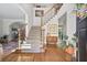 Inviting foyer with hardwood floors, a staircase with iron spindles, and elegant decor at 880 Crossfire Nw Rdg, Marietta, GA 30064