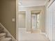 Bright hallway with carpeted floor, white trim and doors, and access to other rooms at 880 Crossfire Nw Rdg, Marietta, GA 30064