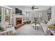 Bright living room with a cozy fireplace, plantation shutters, and large windows for natural light at 880 Crossfire Nw Rdg, Marietta, GA 30064