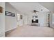 Spacious living room with neutral walls, ceiling fan and views of a bathroom at 880 Crossfire Nw Rdg, Marietta, GA 30064