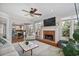 Open living room with hardwood floors, fireplace, ceiling fan, and lots of natural light at 880 Crossfire Nw Rdg, Marietta, GA 30064