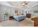 Spacious main bedroom with a tray ceiling, neutral tones, and plenty of natural light at 880 Crossfire Nw Rdg, Marietta, GA 30064