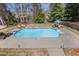 A backyard swimming pool is surrounded by lounge chairs, perfect for relaxation at 880 Crossfire Nw Rdg, Marietta, GA 30064
