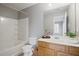 Well-lit bathroom featuring a tub with shower, a vanity with ample storage, and a large mirror at 1754 Heights Nw Cir # 11, Kennesaw, GA 30152