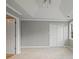 Spacious bedroom featuring tray ceilings, neutral carpet, and a double-door closet for ample storage at 1754 Heights Nw Cir # 11, Kennesaw, GA 30152