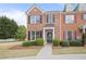 Charming brick townhome with manicured landscaping and black shutters offers classic curb appeal at 1754 Heights Nw Cir # 11, Kennesaw, GA 30152