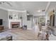 Open-concept living space with hardwood floors, fireplace, and easy access to the dining area at 1754 Heights Nw Cir # 11, Kennesaw, GA 30152
