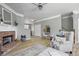 Spacious living room with fireplace, hardwood floors, and stairs leading to the upper level at 1754 Heights Nw Cir # 11, Kennesaw, GA 30152