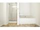 Clean bathroom featuring shower and bathtub at 2572 Avery Park Cir, Doraville, GA 30360