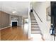 Spacious entryway with hardwood floors, a fireplace, and staircase leading upstairs at 2572 Avery Park Cir, Doraville, GA 30360