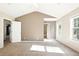 Spacious main bedroom featuring high ceilings, a ceiling fan, and natural light streaming through large windows at 2572 Avery Park Cir, Doraville, GA 30360