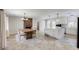 Spacious kitchen featuring a large island, modern appliances, and an adjacent dining area at 5130 N Peachtree Rd, Dunwoody, GA 30338