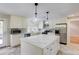Modern kitchen with stainless steel appliances, an island, and ample counter space at 5130 N Peachtree Rd, Dunwoody, GA 30338
