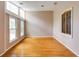 Bright living room features hardwood floors, and an abundance of natural light from large windows at 5130 N Peachtree Rd, Dunwoody, GA 30338