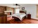Bedroom with a brick fireplace, wood floors, and ample natural light at 5130 N Peachtree Rd, Dunwoody, GA 30338