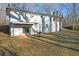 Exterior view of home with a gently sloping backyard and patio at 5496 Davis Dr, Austell, GA 30106