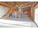 Spacious unfinished basement with exposed beams, offering potential for customization and expansion at 5496 Davis Dr, Austell, GA 30106