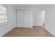 Bright and minimalist bedroom featuring modern hardwood floors and generous natural light at 5496 Davis Dr, Austell, GA 30106