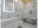 Modern bathroom featuring a glass shower, double shower head, marble tiles, and a sleek floating vanity at 1060 Mcdaniel Sw St, Atlanta, GA 30310