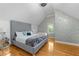 Bedroom featuring a luxurious upholstered bed frame and hardwood floors at 1060 Mcdaniel Sw St, Atlanta, GA 30310