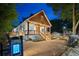 Beautiful home with a covered front porch, brick driveway, and landscaped front yard at twilight at 1060 Mcdaniel Sw St, Atlanta, GA 30310