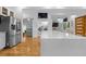 Modern kitchen featuring stainless steel appliances, a large island, and hardwood floors at 1060 Mcdaniel Sw St, Atlanta, GA 30310