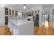 A modern kitchen with white cabinets, stainless steel appliances, and a central island at 1060 Mcdaniel Sw St, Atlanta, GA 30310