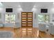 Bright living room with double doors, hardwood floors, and ample seating at 1060 Mcdaniel Sw St, Atlanta, GA 30310